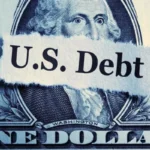 Bitcoin Might Not Kill Dollar, but It’s US Debt Economist